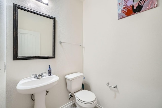 bathroom featuring toilet