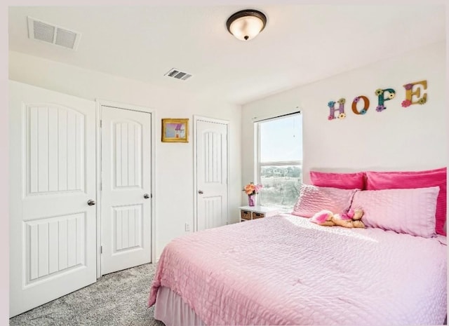 bedroom featuring light colored carpet