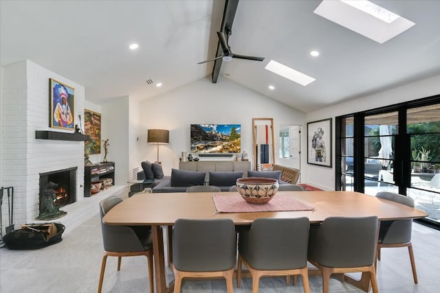 dining room with lofted ceiling with skylight and a brick fireplace