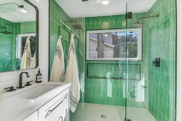 bathroom with vanity and an enclosed shower