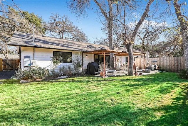 back of house featuring a yard and a patio area