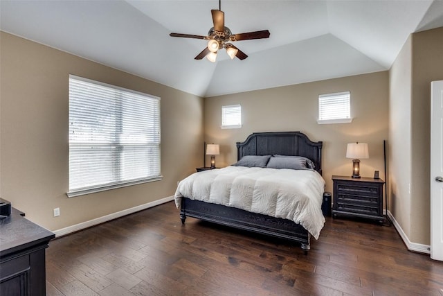 bedroom with dark wood-type flooring, ceiling fan, and vaulted ceiling