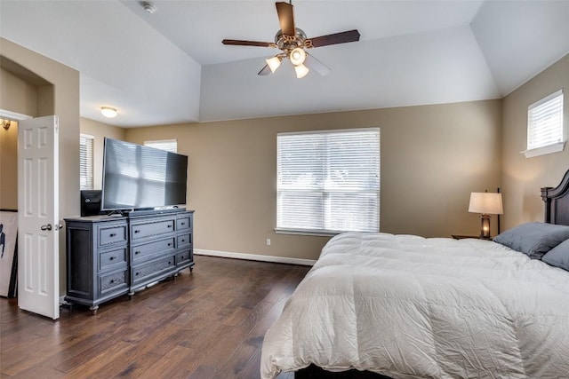 bedroom featuring ceiling fan, dark hardwood / wood-style flooring, and a raised ceiling