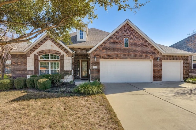 front facade with a garage and a front yard