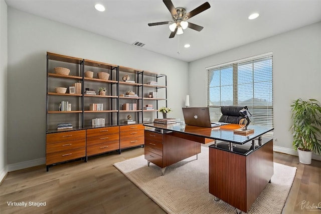 office area with wood-type flooring and ceiling fan