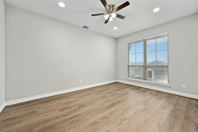 spare room with ceiling fan and light hardwood / wood-style flooring