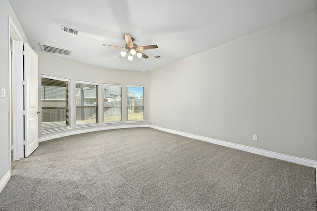 unfurnished room with ceiling fan and carpet flooring