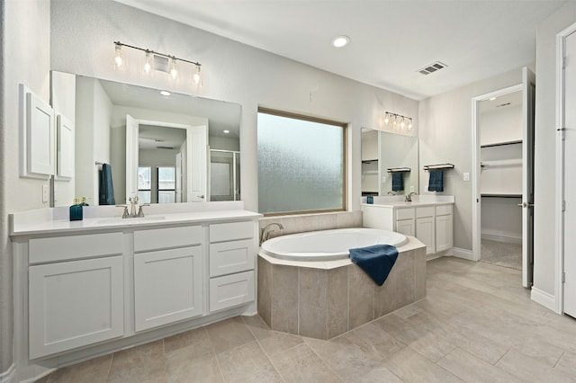 bathroom with vanity, separate shower and tub, and tile patterned flooring