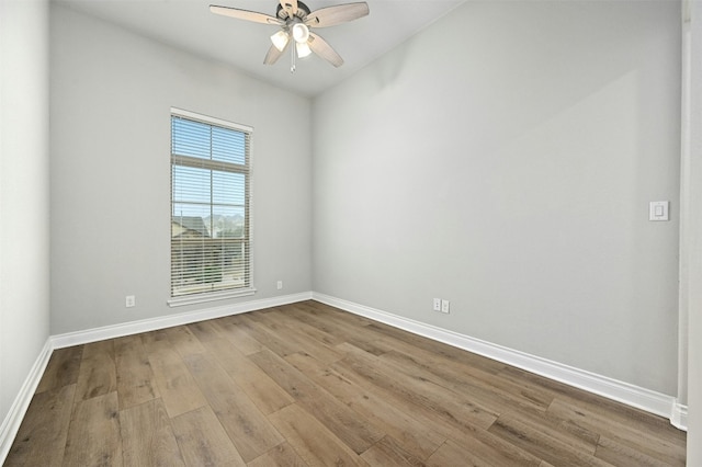 unfurnished room with ceiling fan and light wood-type flooring