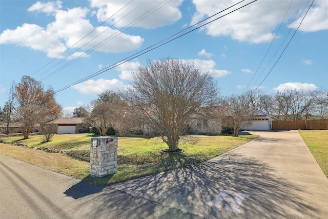 view of front facade featuring a garage and a front lawn