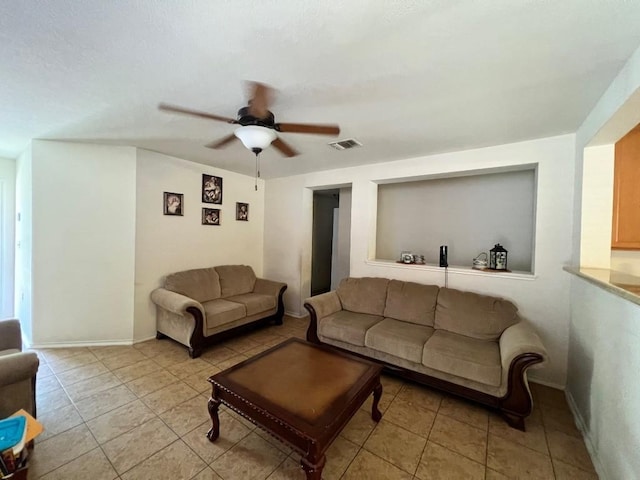 tiled living room featuring ceiling fan