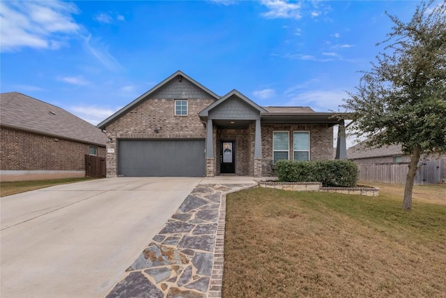 craftsman-style house featuring a garage and a front yard