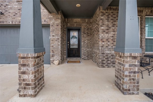 doorway to property featuring a garage