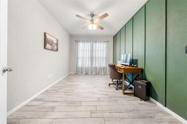 office with ceiling fan and light hardwood / wood-style flooring