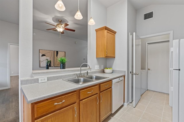 kitchen with sink, white appliances, light tile patterned floors, ceiling fan, and decorative light fixtures