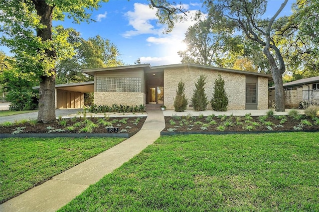 modern home featuring a carport and a front yard