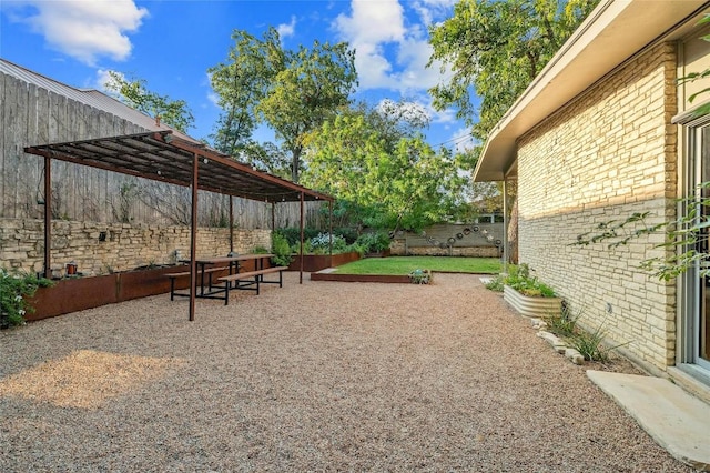 view of yard with a pergola and a patio