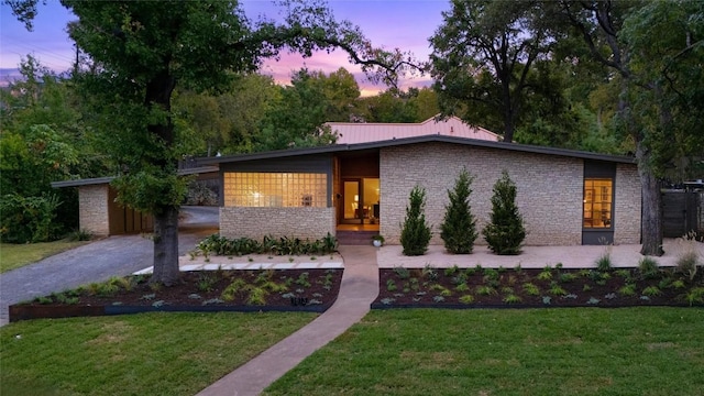 contemporary home with a yard