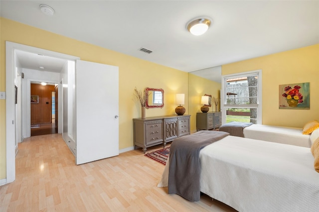 bedroom with light hardwood / wood-style floors