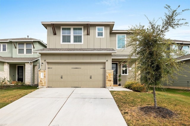 view of front of property featuring stone siding, a front yard, board and batten siding, and concrete driveway