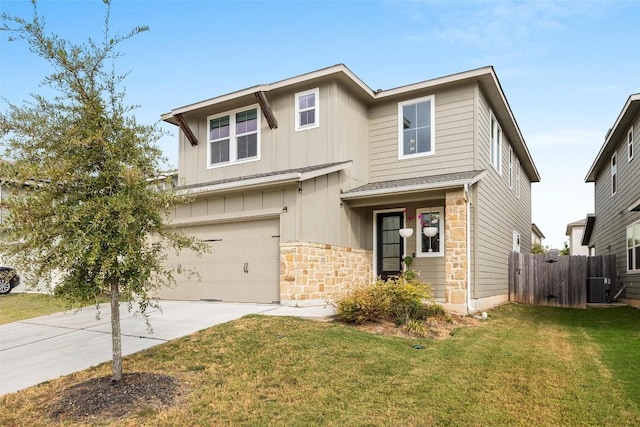 view of front of property featuring a garage, a front yard, and central air condition unit