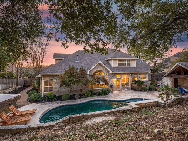 13312 Country Lake Dr, Austin, TX 78732 - pool at dusk with a patio and a fenced backyard
