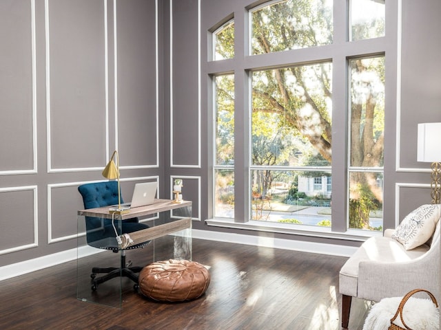 13312 Country Lake Dr, Austin, TX 78732 - office area with baseboards, a decorative wall, and wood finished floors