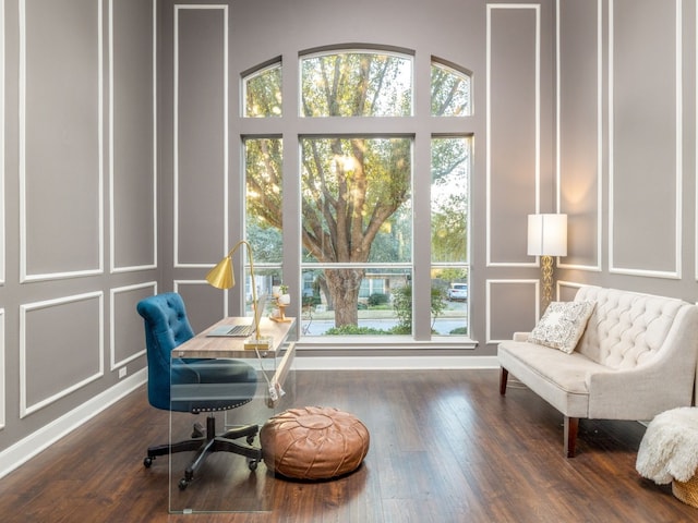 13312 Country Lake Dr, Austin, TX 78732 - office area with a decorative wall, wood finished floors, and baseboards