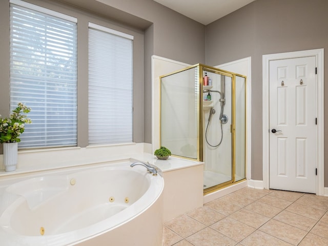 bathroom featuring plus walk in shower and tile patterned floors