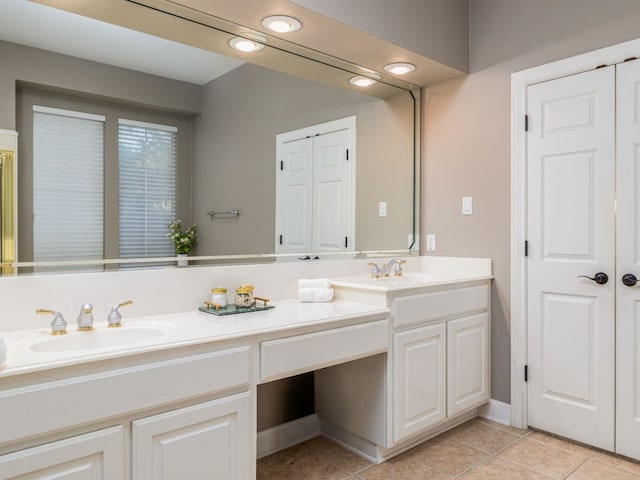 bathroom with vanity and tile patterned flooring