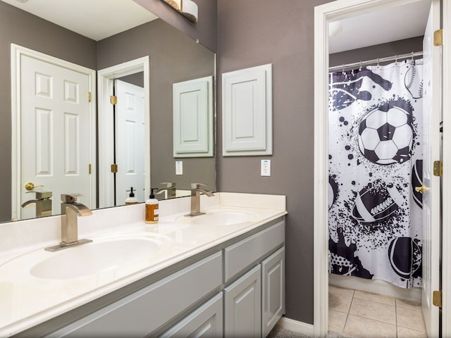 bathroom with a shower with curtain, vanity, and tile patterned flooring