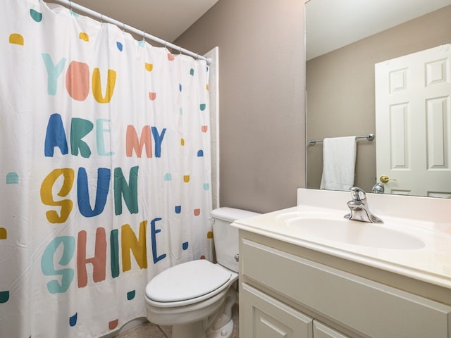 bathroom featuring vanity, toilet, and walk in shower