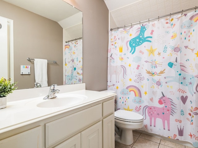 bathroom featuring vanity, curtained shower, tile patterned floors, and toilet