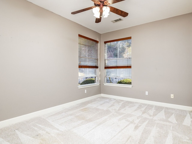 13312 Country Lake Dr, Austin, TX 78732 - spare room featuring a ceiling fan, baseboards, and light colored carpet