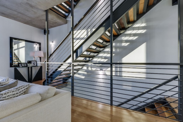 stairway with hardwood / wood-style floors