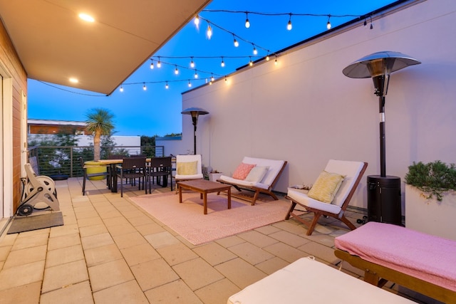 view of patio terrace at dusk