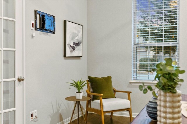 living area with hardwood / wood-style floors