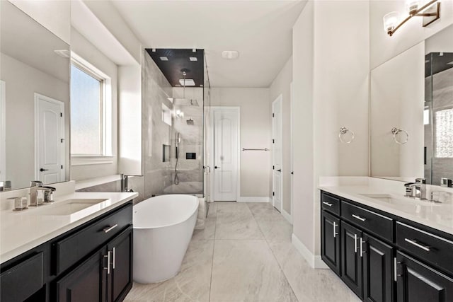 2513 Long Lasso Pass, Leander, TX 78641 - full bathroom featuring a shower stall, two vanities, healthy amount of natural light, and a freestanding bath
