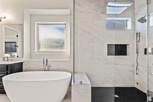 bathroom with vanity, tile walls, and plus walk in shower