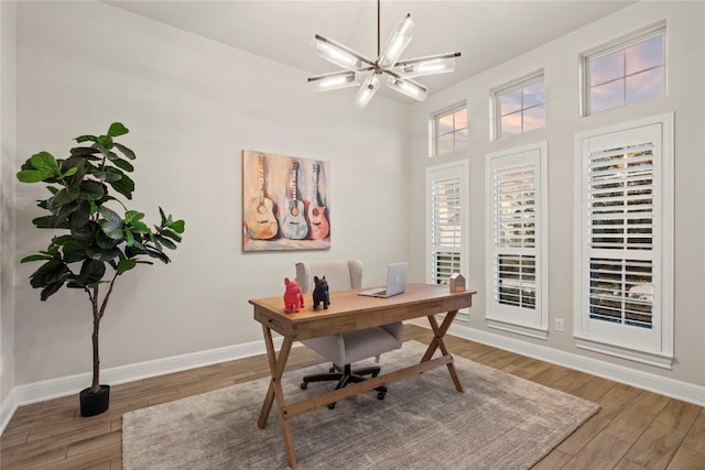 office featuring hardwood / wood-style flooring and a chandelier