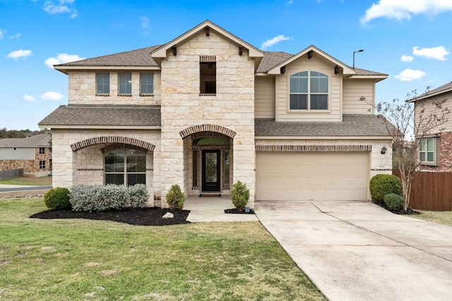 view of front of house featuring a garage and a front yard