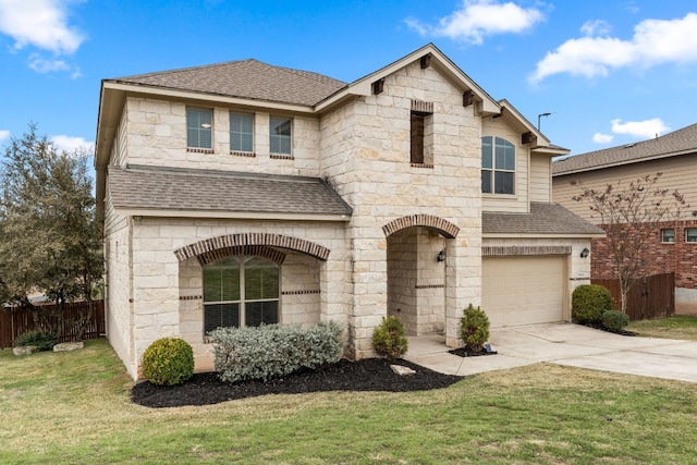 front of property featuring a garage and a front lawn