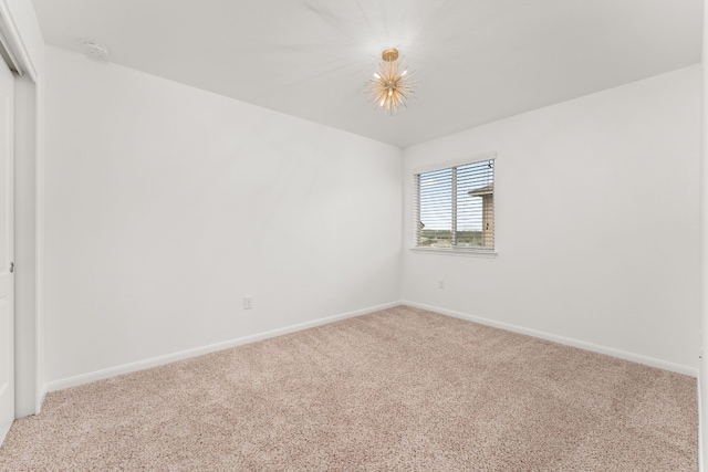 unfurnished room with carpet flooring