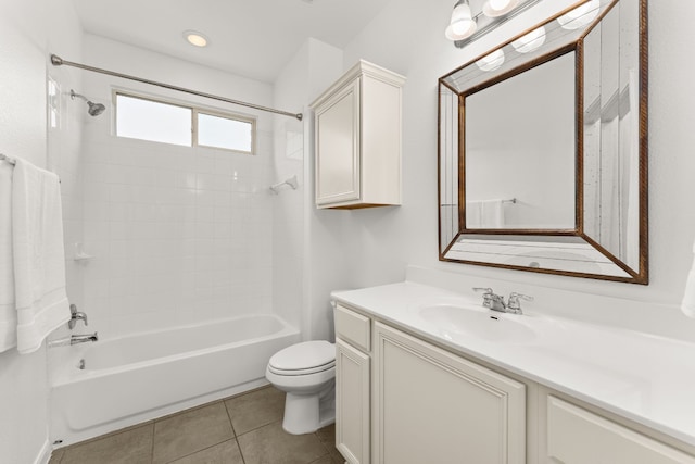 full bathroom featuring vanity, toilet, tiled shower / bath combo, and tile patterned flooring