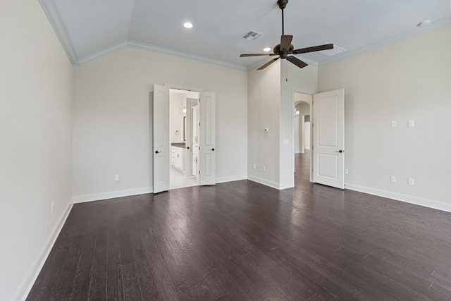 unfurnished room with crown molding, vaulted ceiling, dark wood-type flooring, and ceiling fan