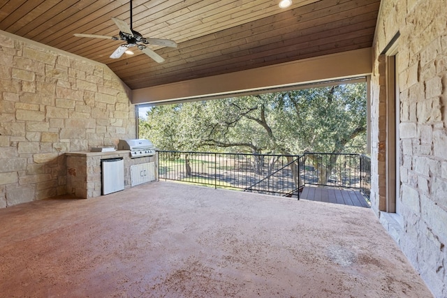 view of patio / terrace featuring grilling area, ceiling fan, and an outdoor kitchen