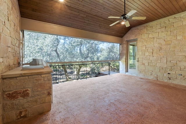 view of patio featuring ceiling fan and exterior kitchen