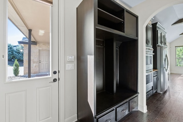 mudroom featuring dark hardwood / wood-style flooring and vaulted ceiling