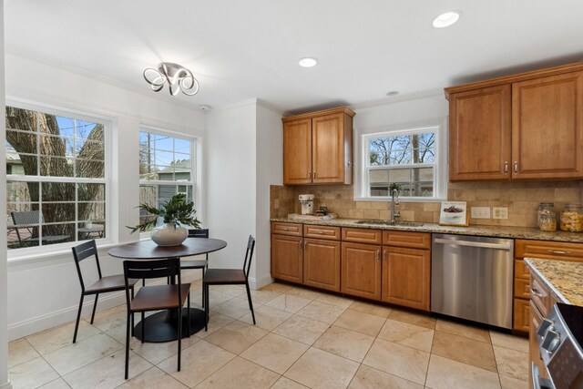 kitchen with dishwasher, sink, backsplash, ornamental molding, and light stone countertops