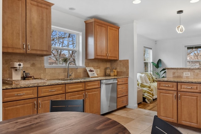 2108 Glendale Pl, Austin, TX 78704 - kitchen featuring light tile patterned flooring, dishwasher, ornamental molding, and light stone countertops